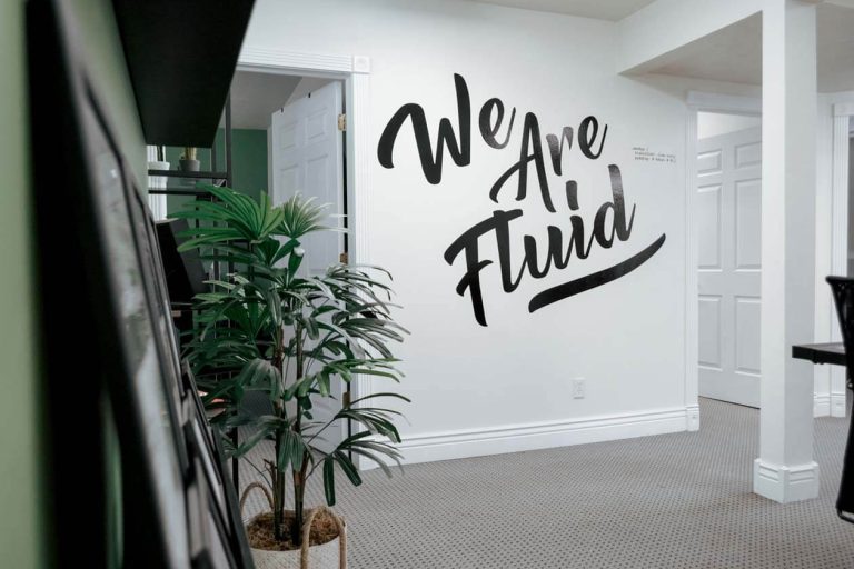 Fluid22 web design we are fluid graphic on wall